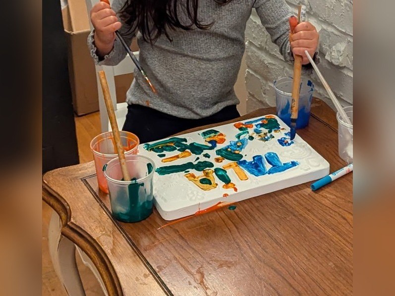 Being painted — Primed white, two brushes going at once