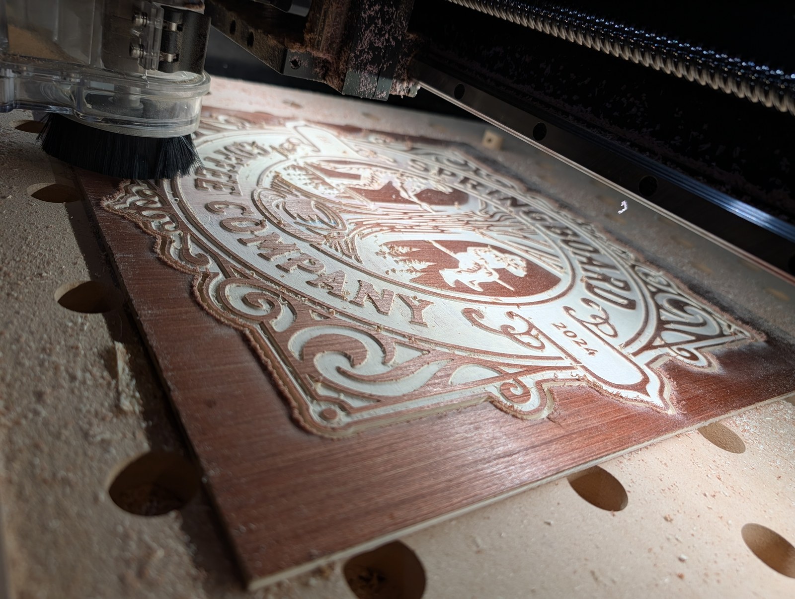 On the machine — Mid-carve, stained before cutting
