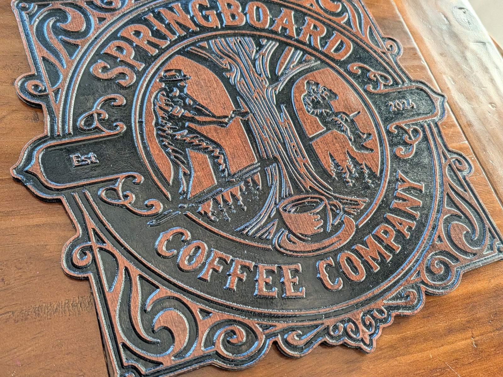 Springboard Coffee Company — Carved crest, filled black
